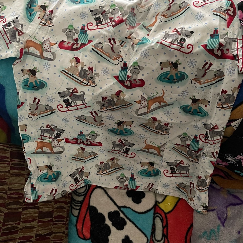 Women’s scrub top from Uniform Advantage. Winter themed print.
